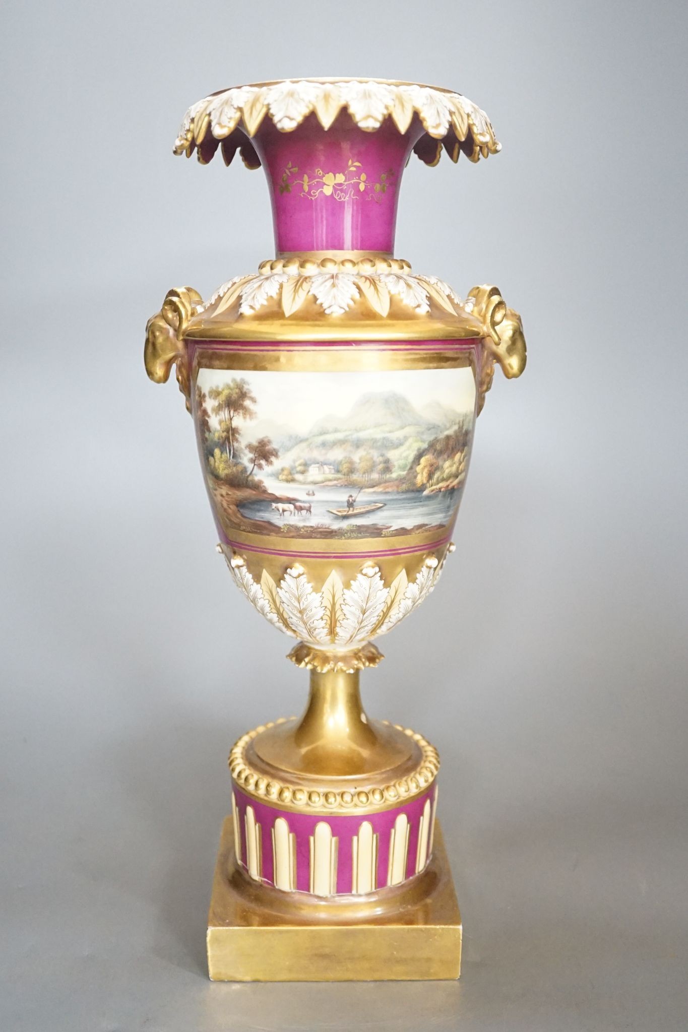 A 19th century English porcelain vase painted with a landscape on crimson ground, Worcester? 35cm